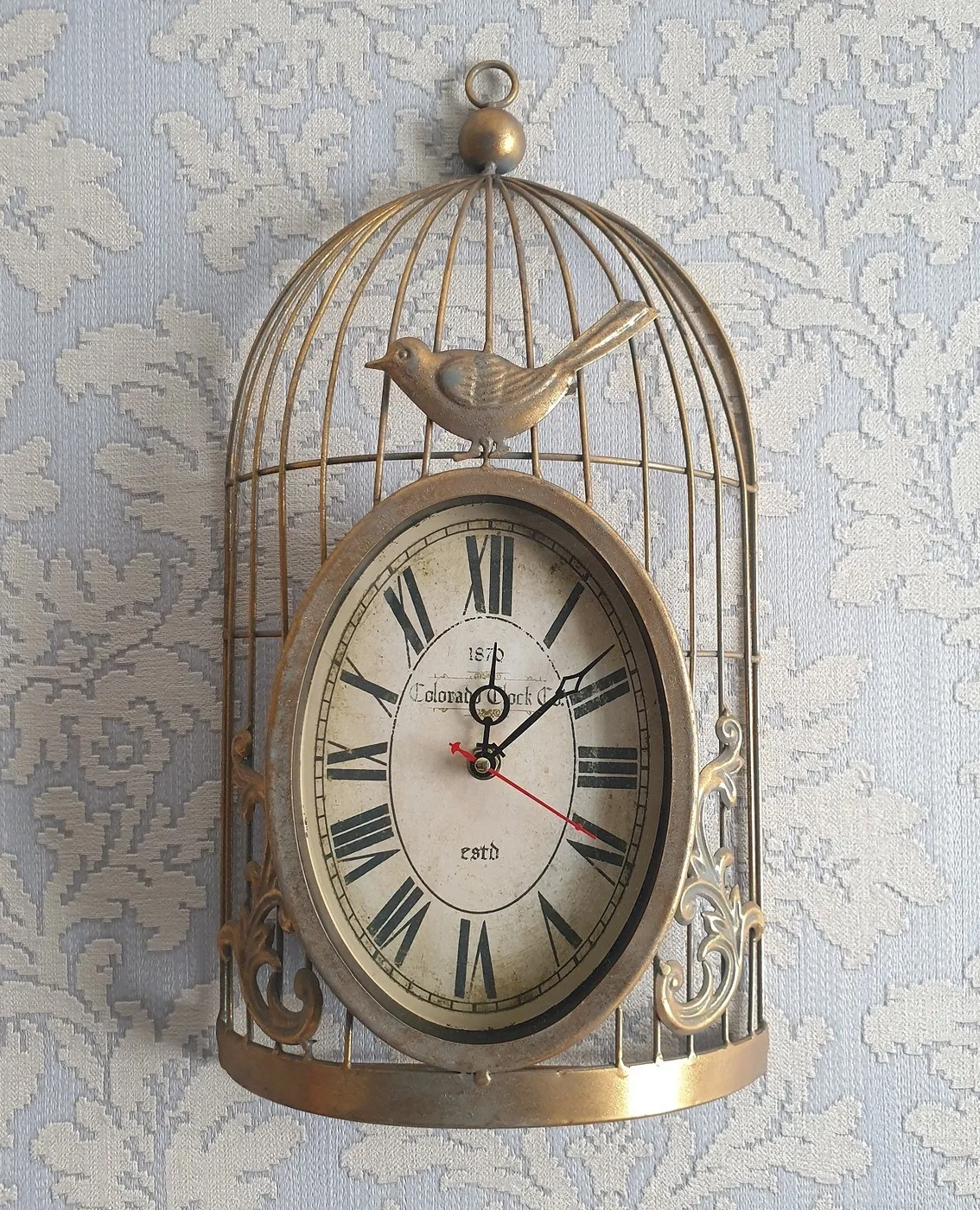 Часы настенные в виде клетки с птичкой